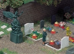 4 świecące grobowce i statua
